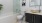 a bathroom with a tub, sink and toilet