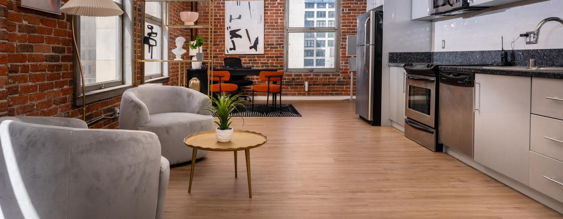 open kitchen with a brick wall