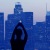 a person standing in front of a city skyline