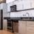 a kitchen with white cabinets