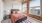 a bedroom with large windows