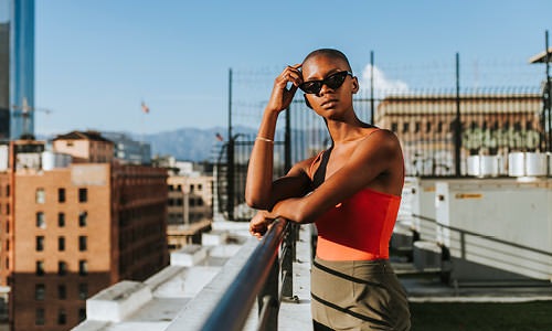 woman on rooftop overlooking the city